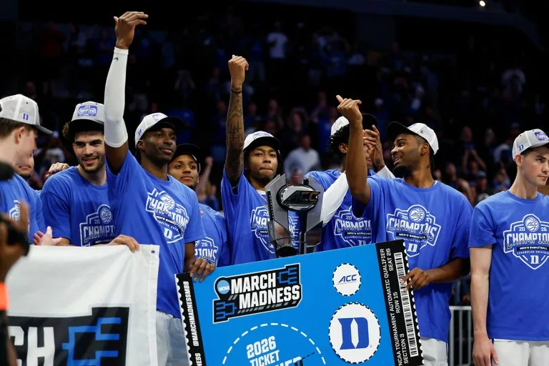 Duke players celebrate earning a spot in the NCAA tournament